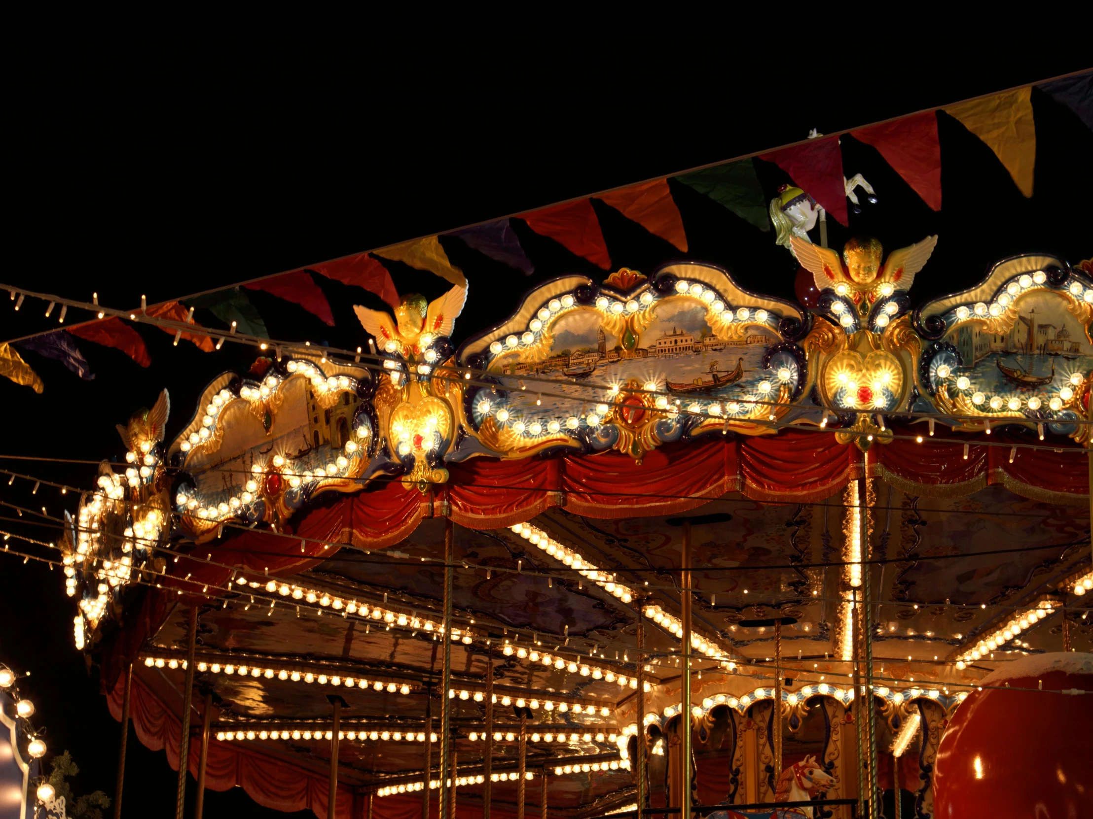 a merry go round in the night with lights