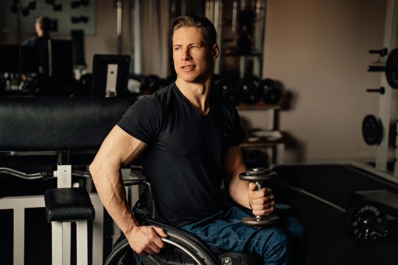 a man sitting down with his wheelchair on his lap