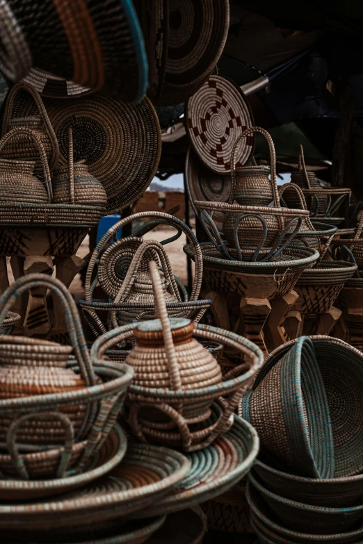 several wicker baskets stacked in rows together