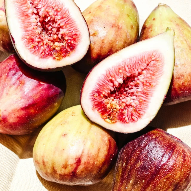 some cut up figs sit together on a table