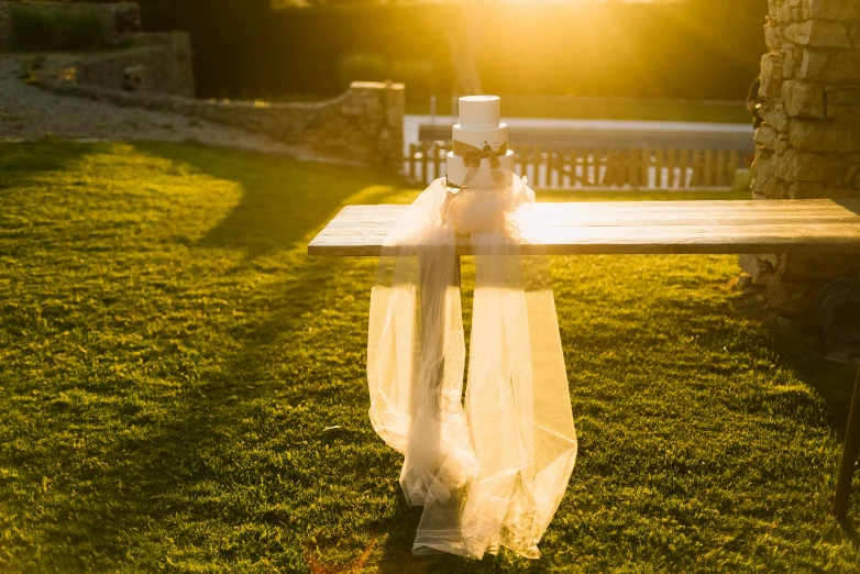 the cross is resting on top of a wooden table