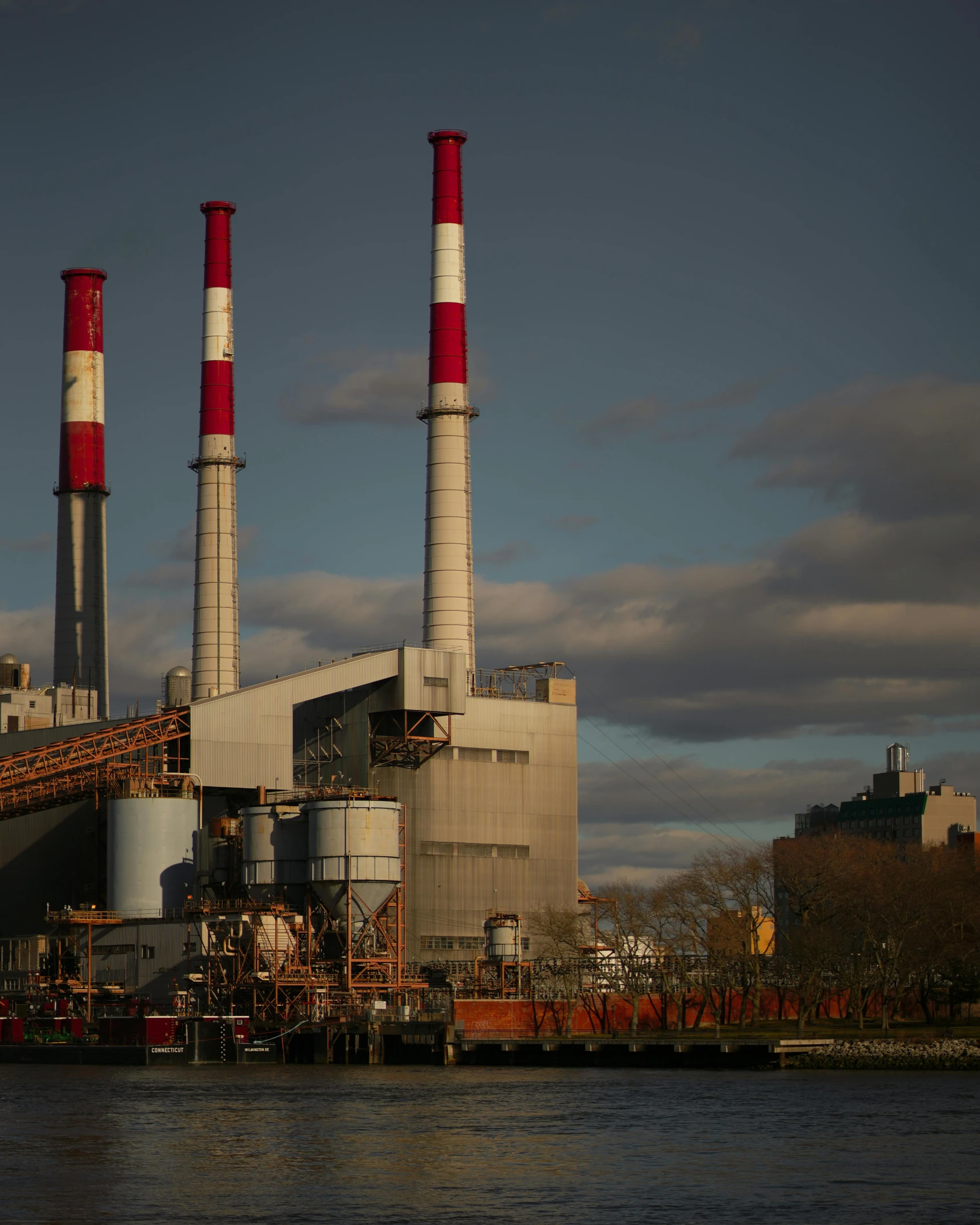 a factory on a river near a shore