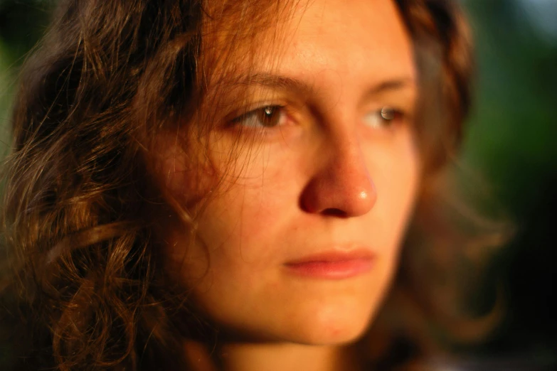 a close up of a woman with wavy hair