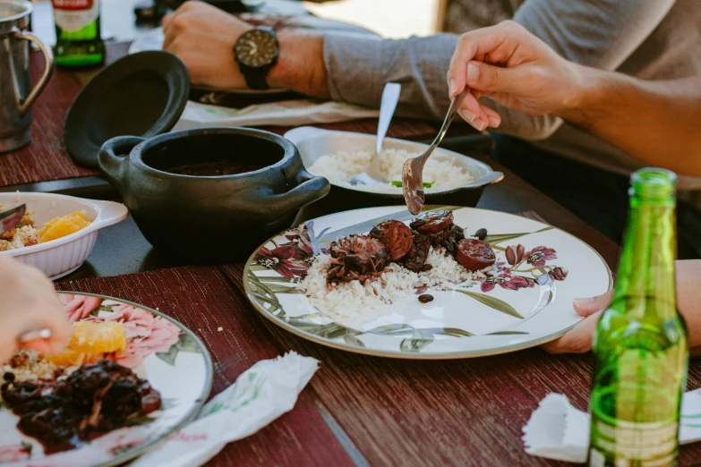 people eating at a table together at the dinner table