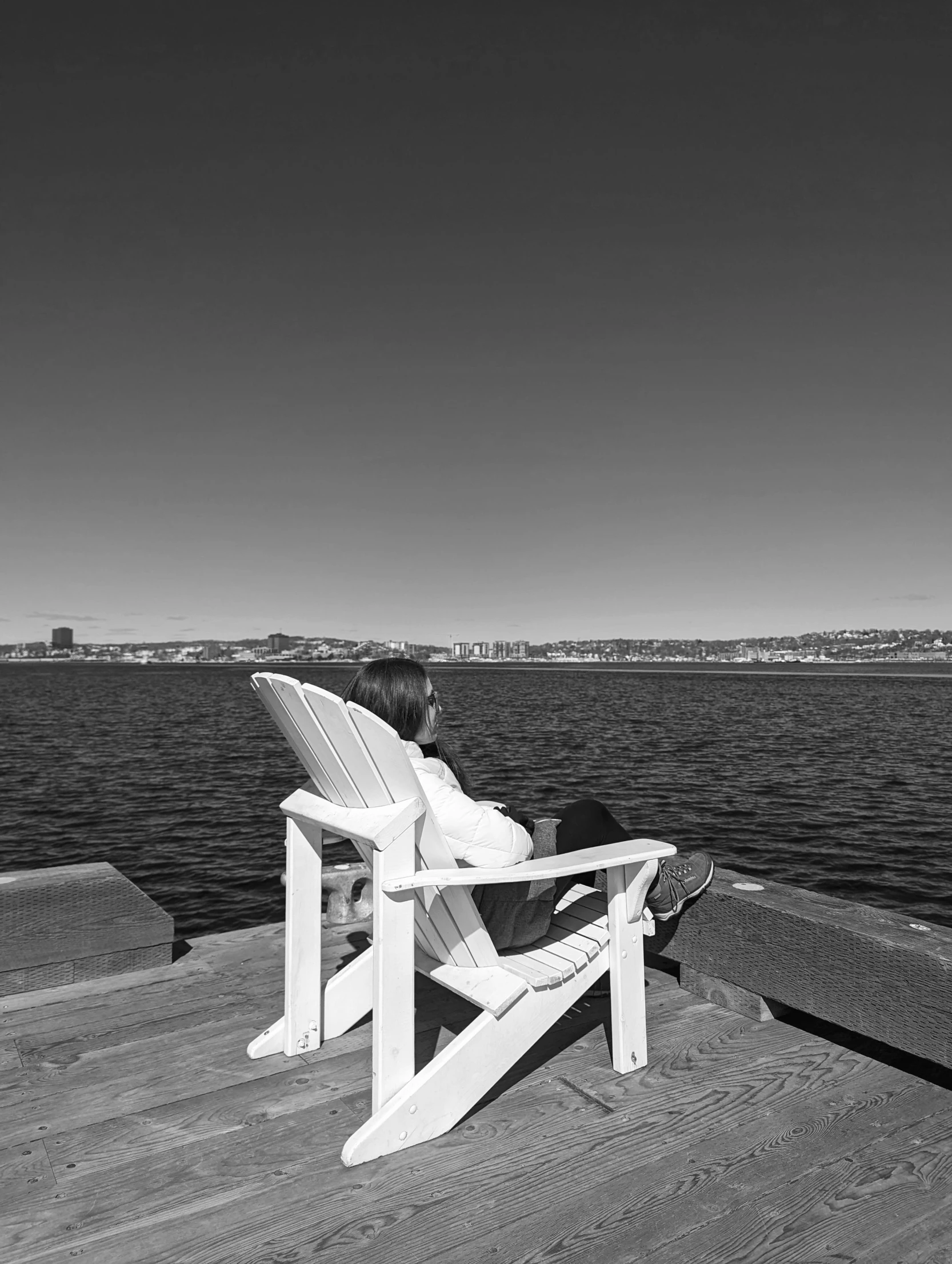 a person sitting on a beach chair