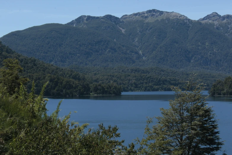 mountain range in the distance with some trees around