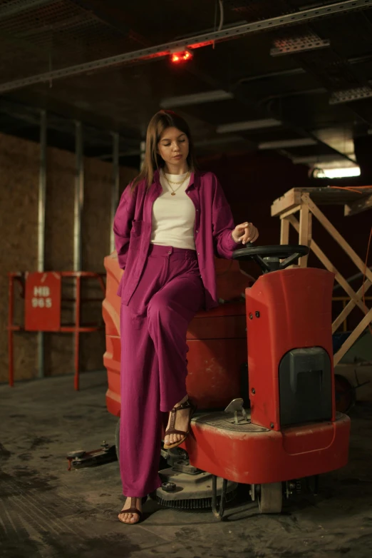 a woman is posing for a po while wearing red