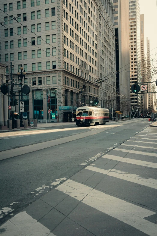 there is a bus that is making it's way down the street