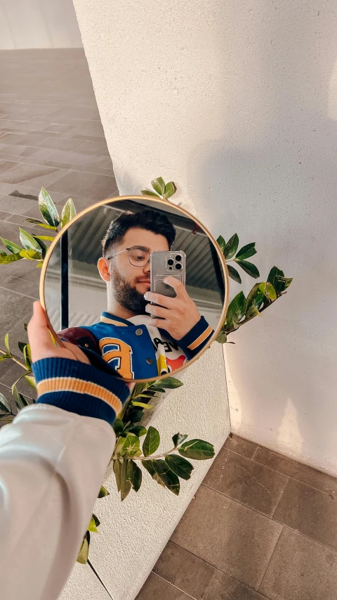 a person taking a selfie in the mirror