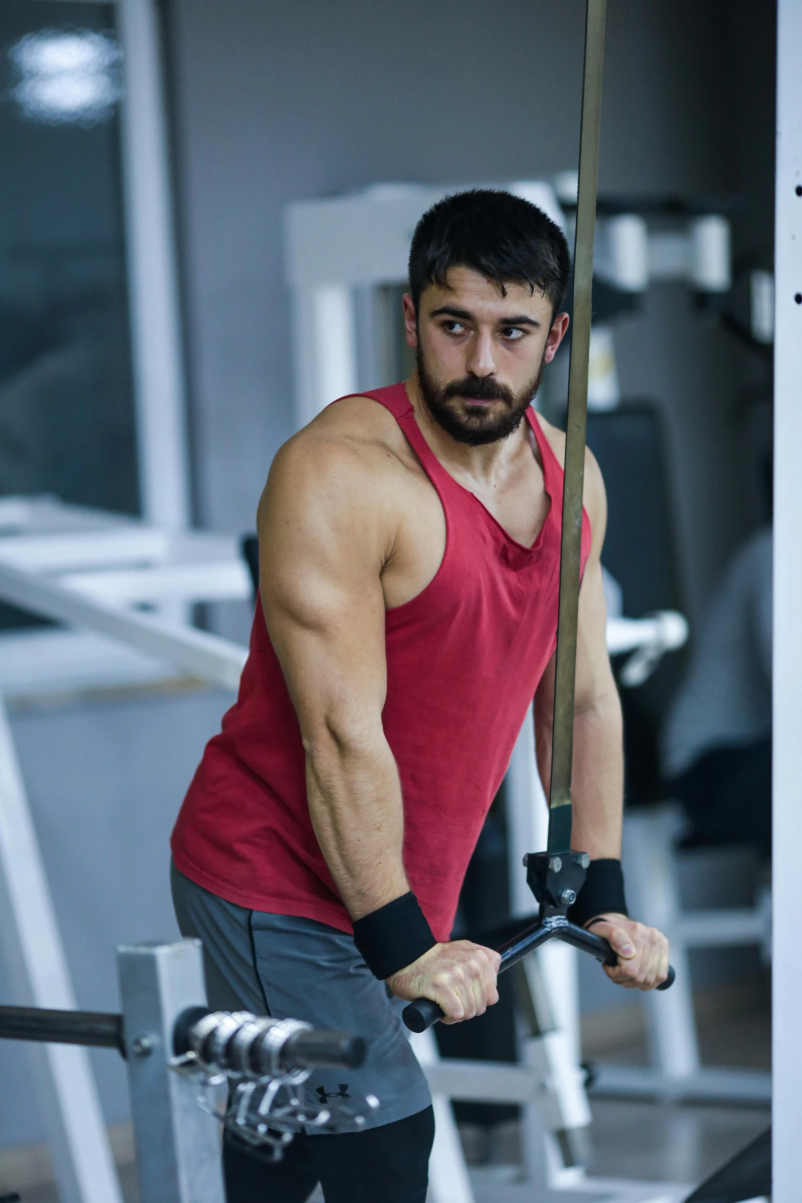 a man working out on an exercise bike with a sword