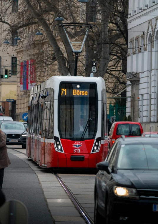 a public transit vehicle traveling down the street