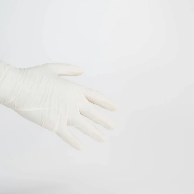 a white glove that is holding soing in it