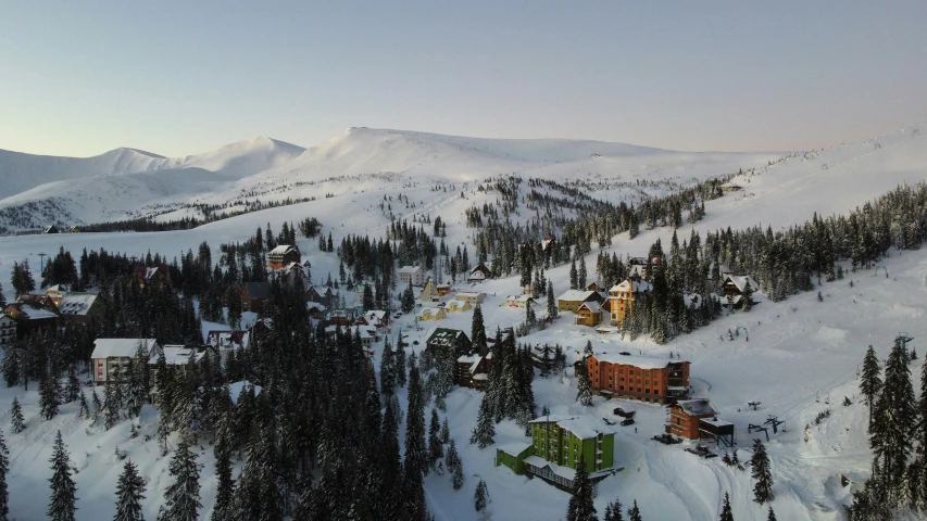 aerial view of a ski resort and resort nestled in the mountains