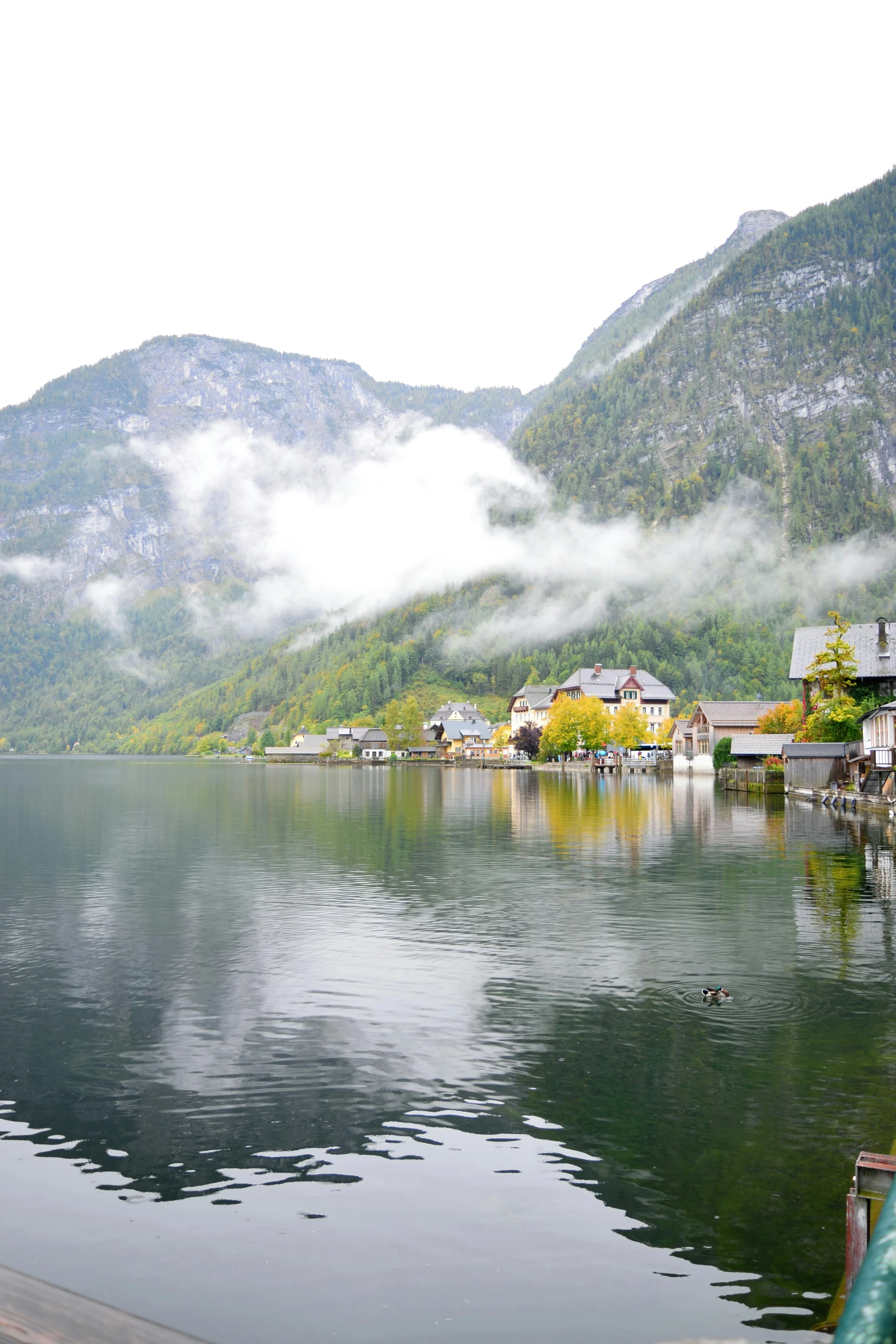 a lake with a house on the shore