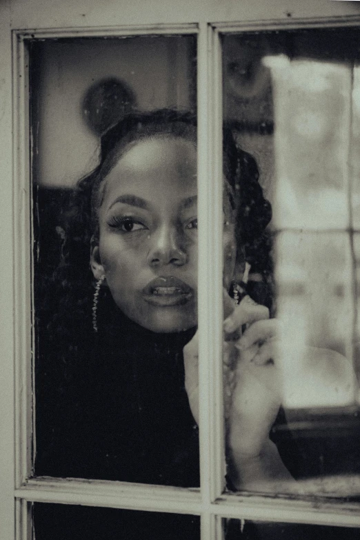 a woman looking out of a window