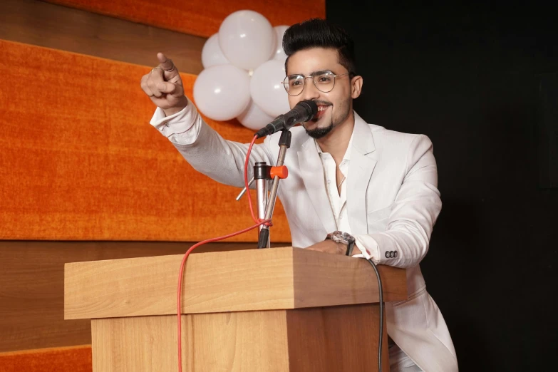 a man is giving a speech at a podium