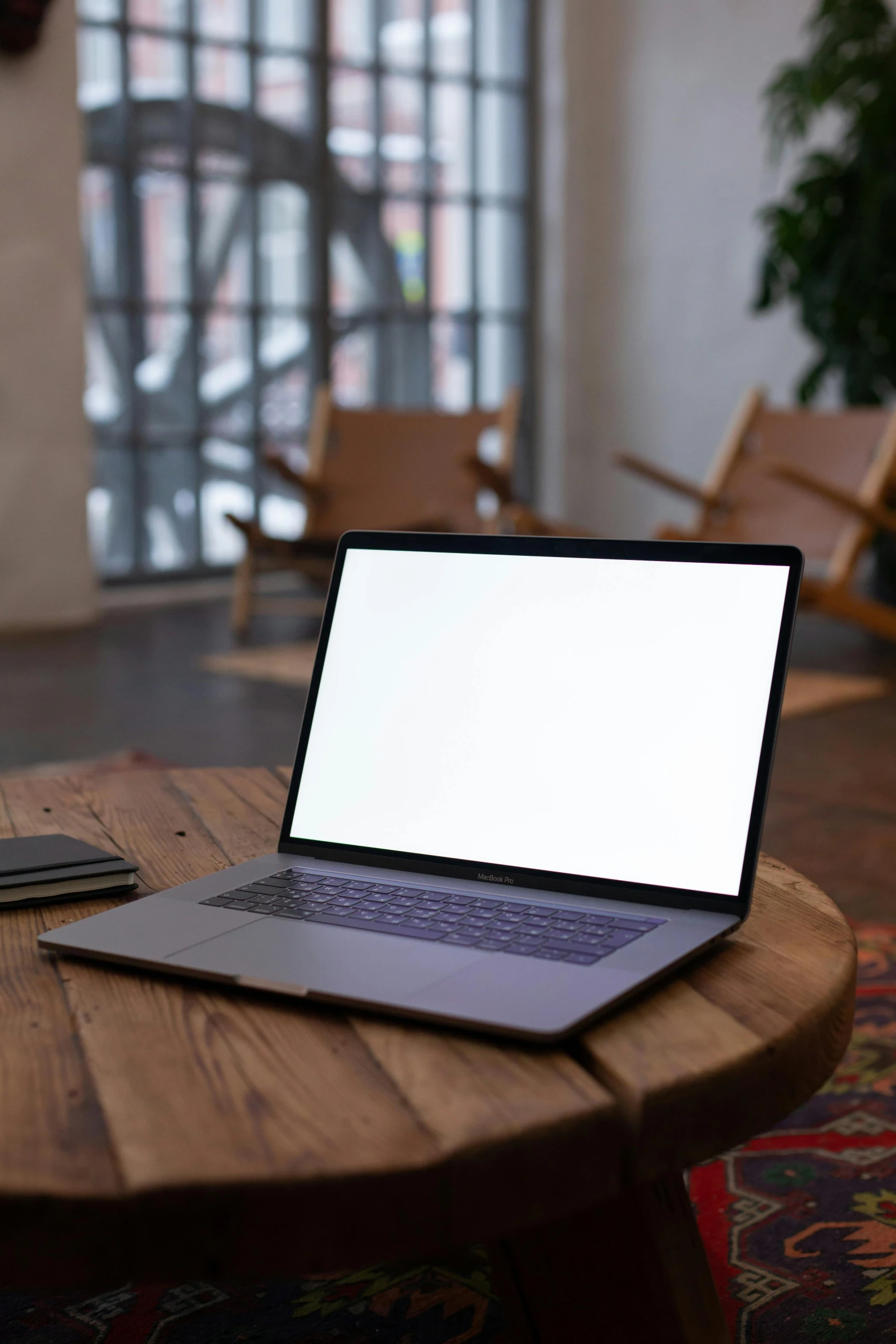 an open laptop is sitting on a table