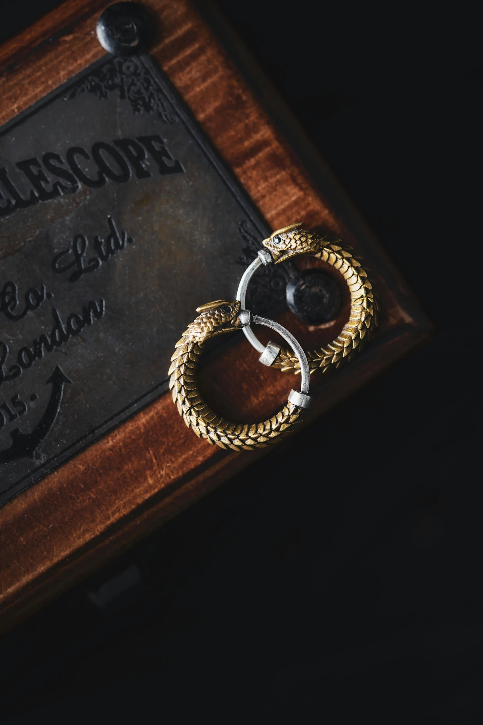 a close up view of two silver and gold rings