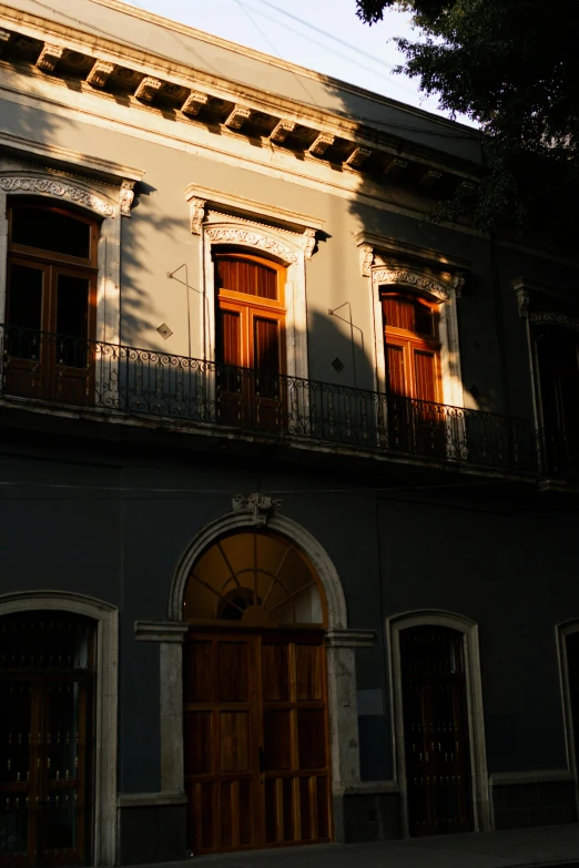 a view of a building facade with brown doors