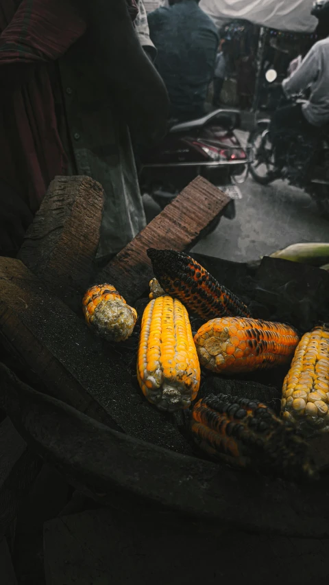 some grilled corn on the cob in an open air grill