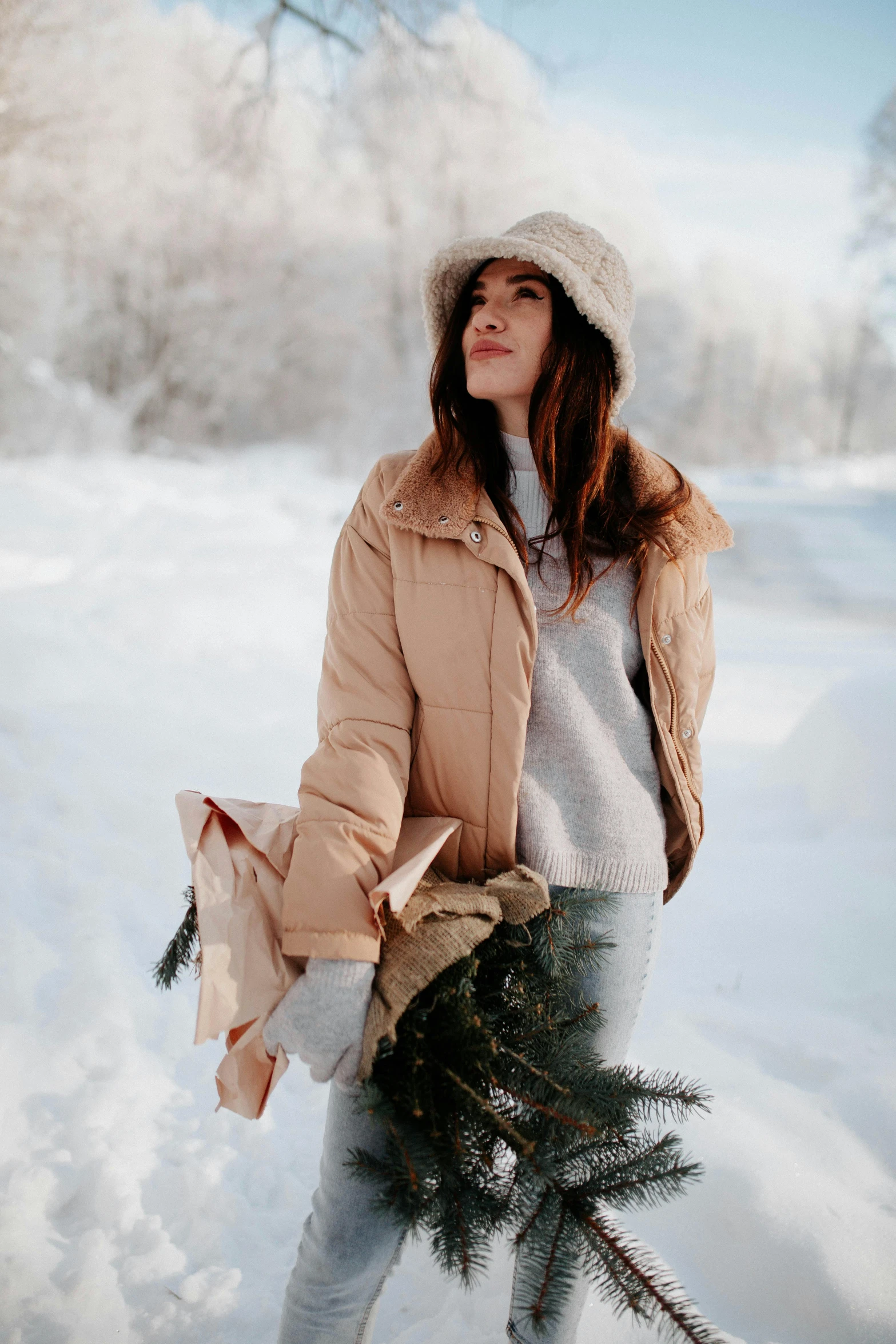 woman wearing winter clothes standing in the snow