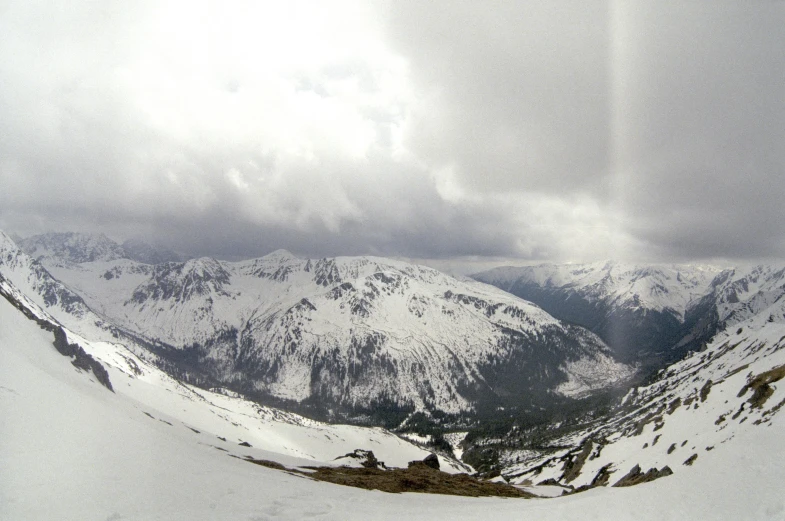 a person skiing on a snowy mountain side