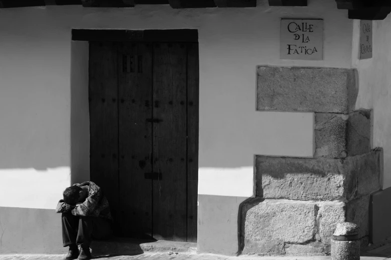 the person standing in front of the door of a house