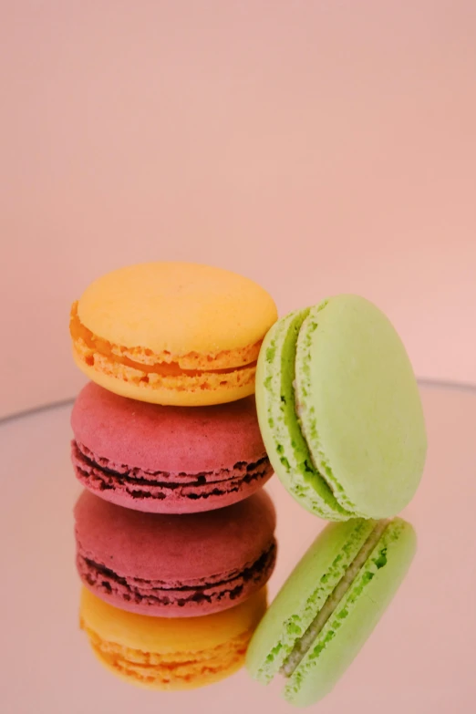 the macaroons have different colors and are stacked on top of each other