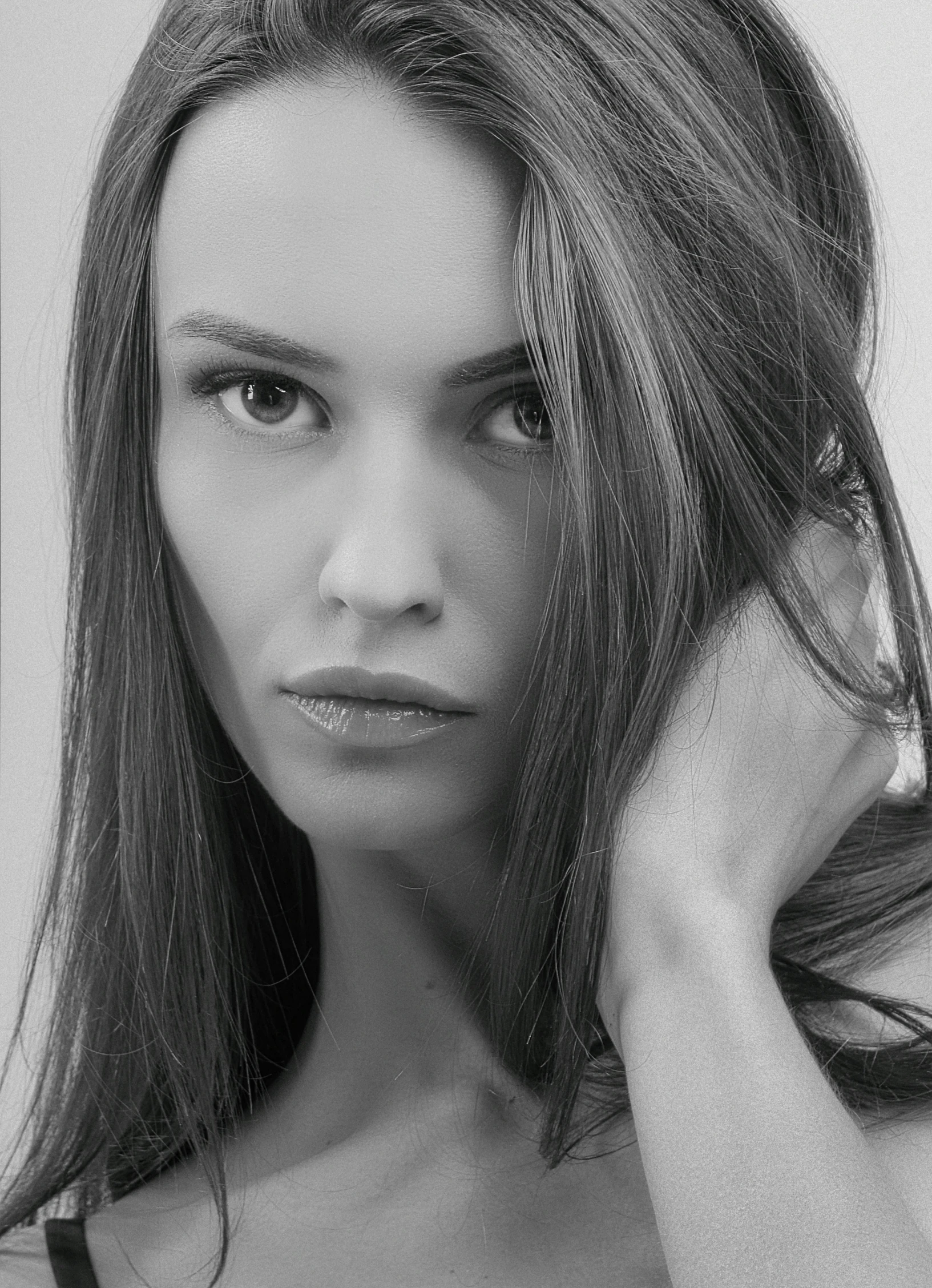 a woman with long hair posing for a po