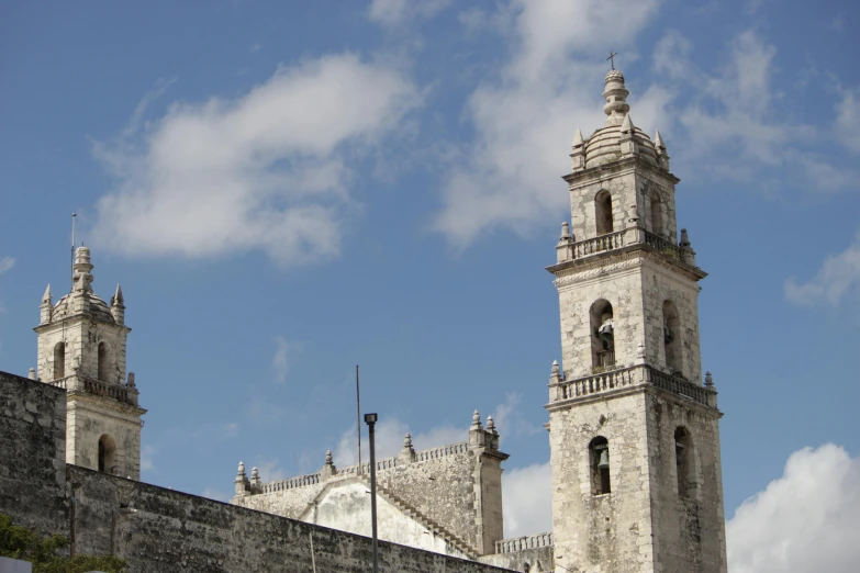 a large white building with two clock towers