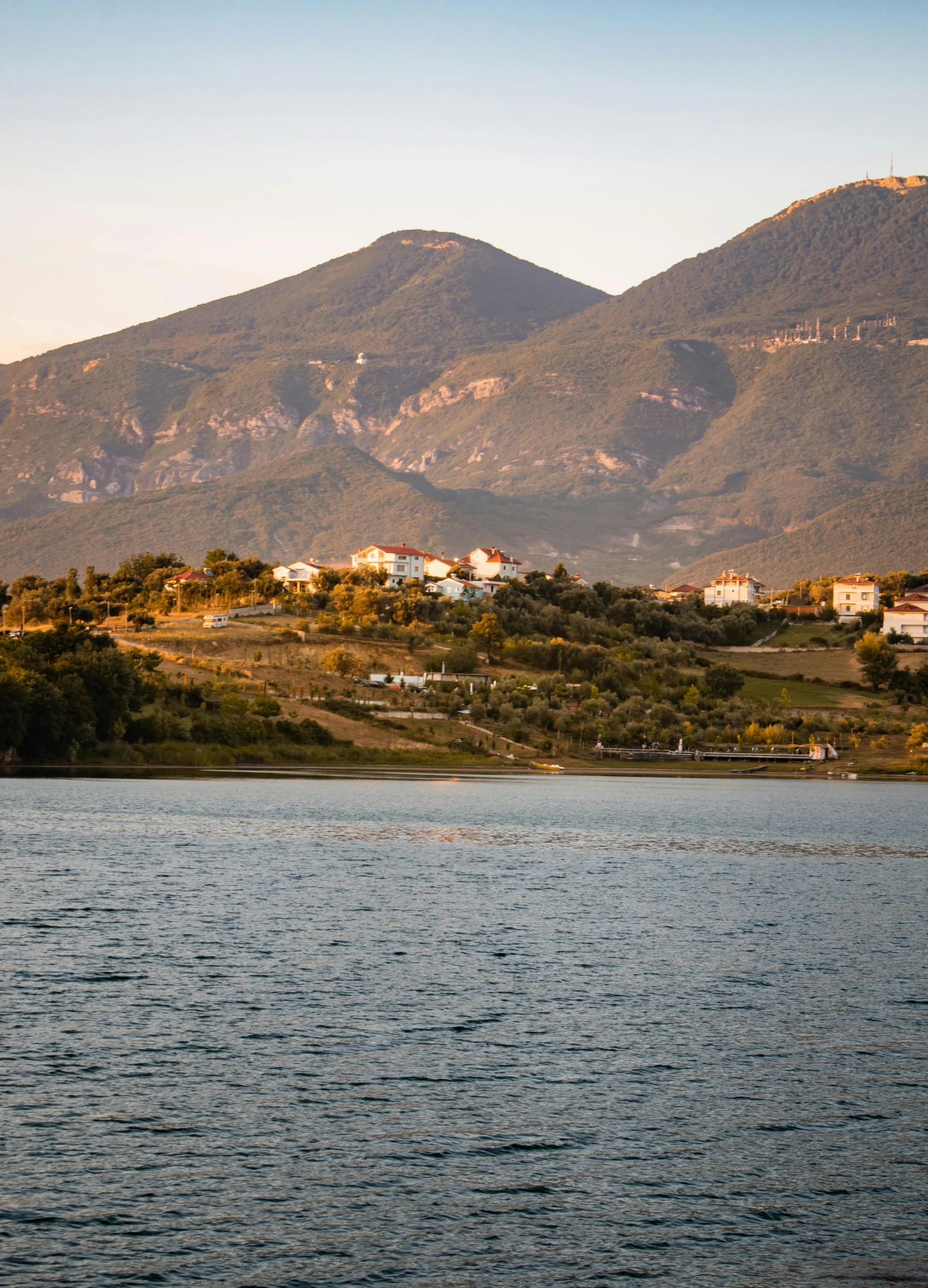 a large body of water near the mountains