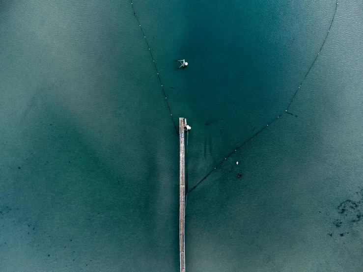 an overhead view of an airport and water