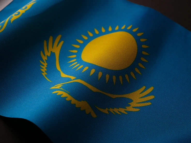 close up of the flag of kazakhstan on a cloth