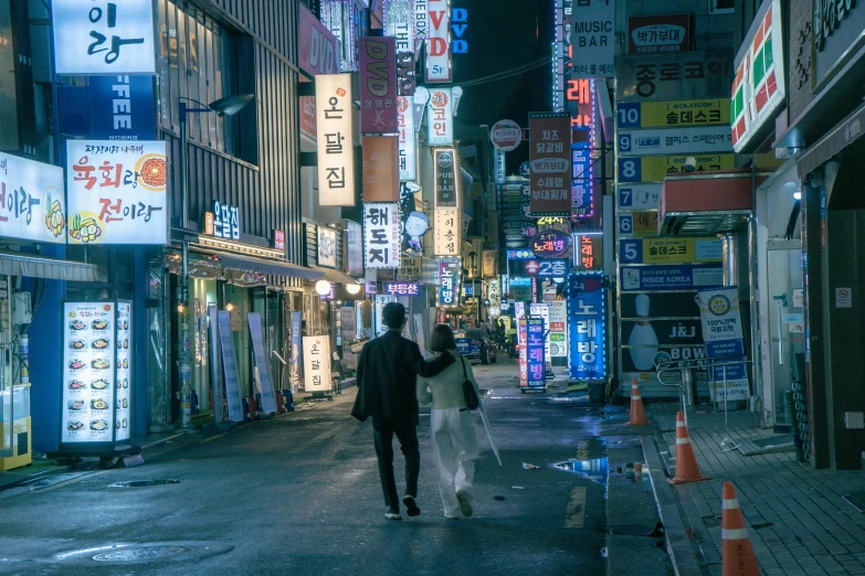people on street in large urban setting at night