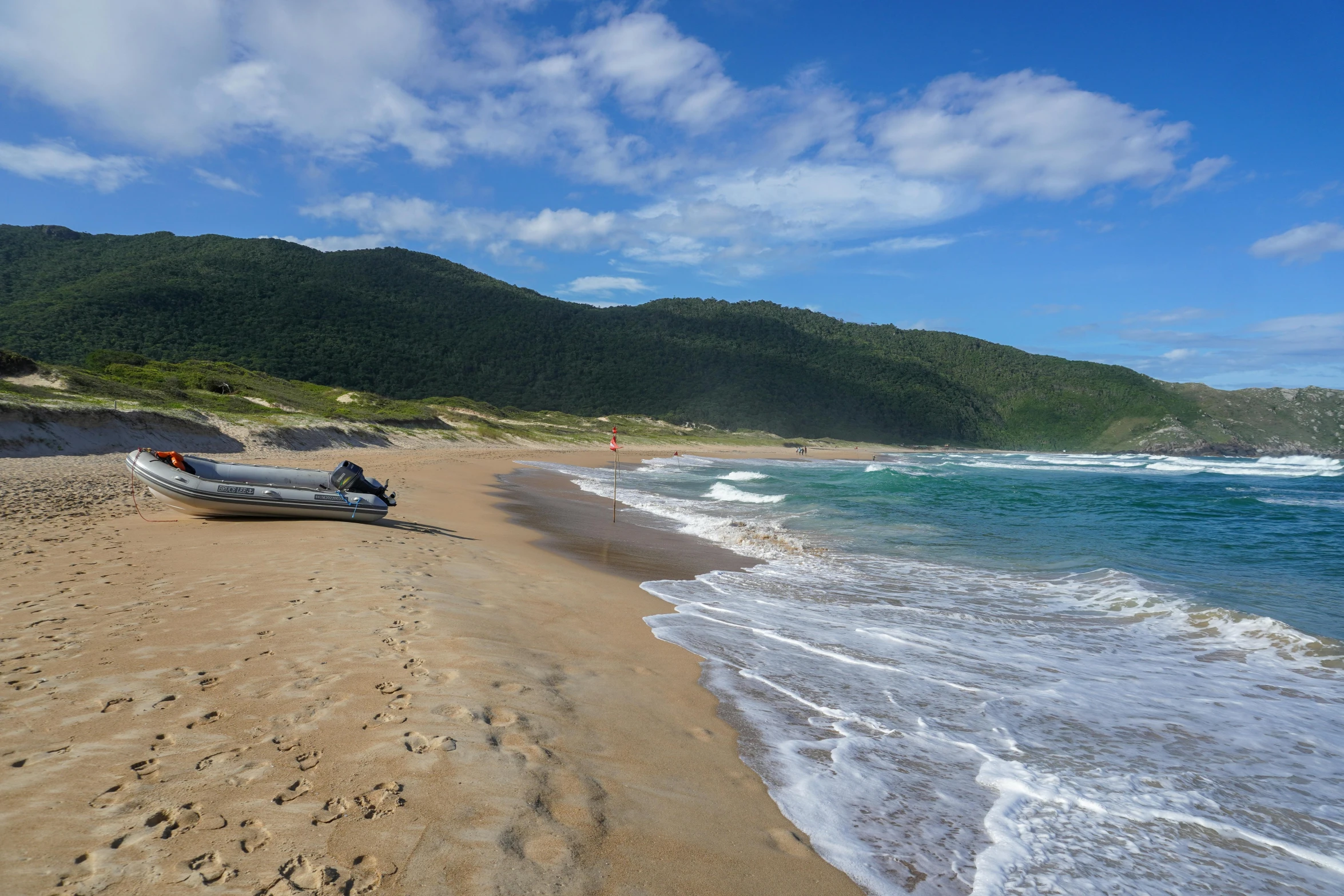 a motorboat is resting on the shore