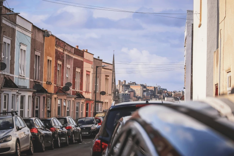 many cars are parked next to the side of the road