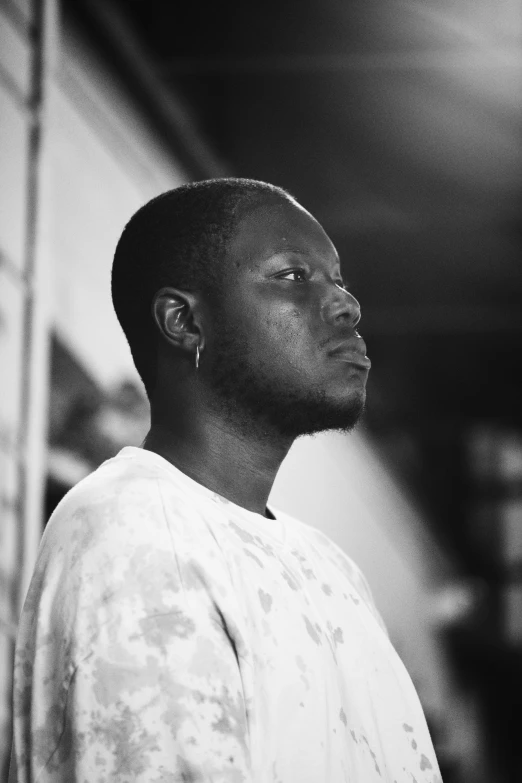 black and white pograph of man staring up to the sky