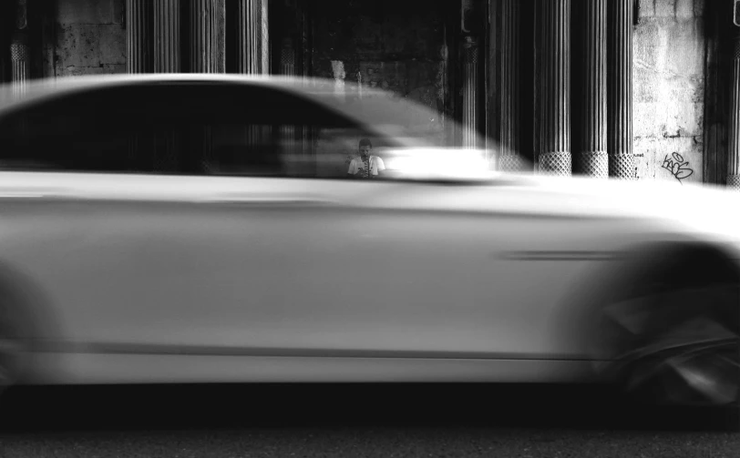 a blurry po of a car on a city street