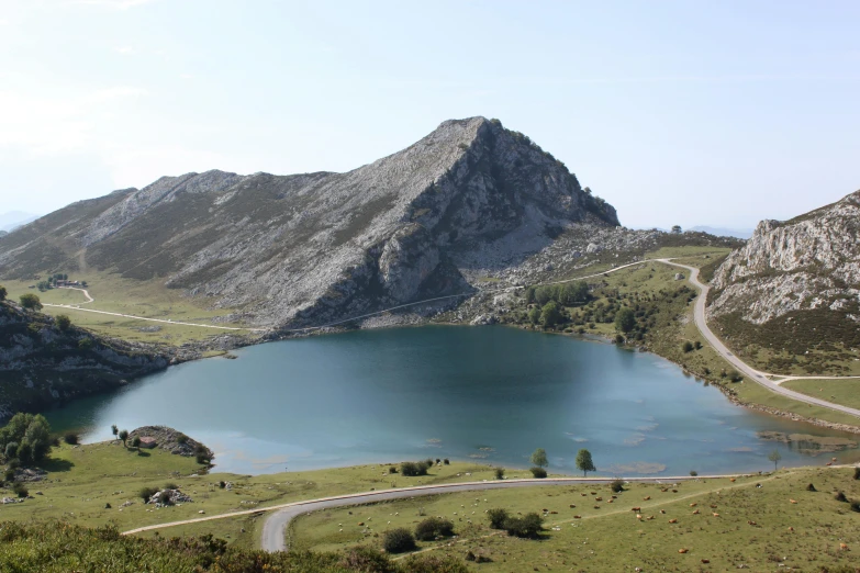 a mountain landscape with large mountains in the distance