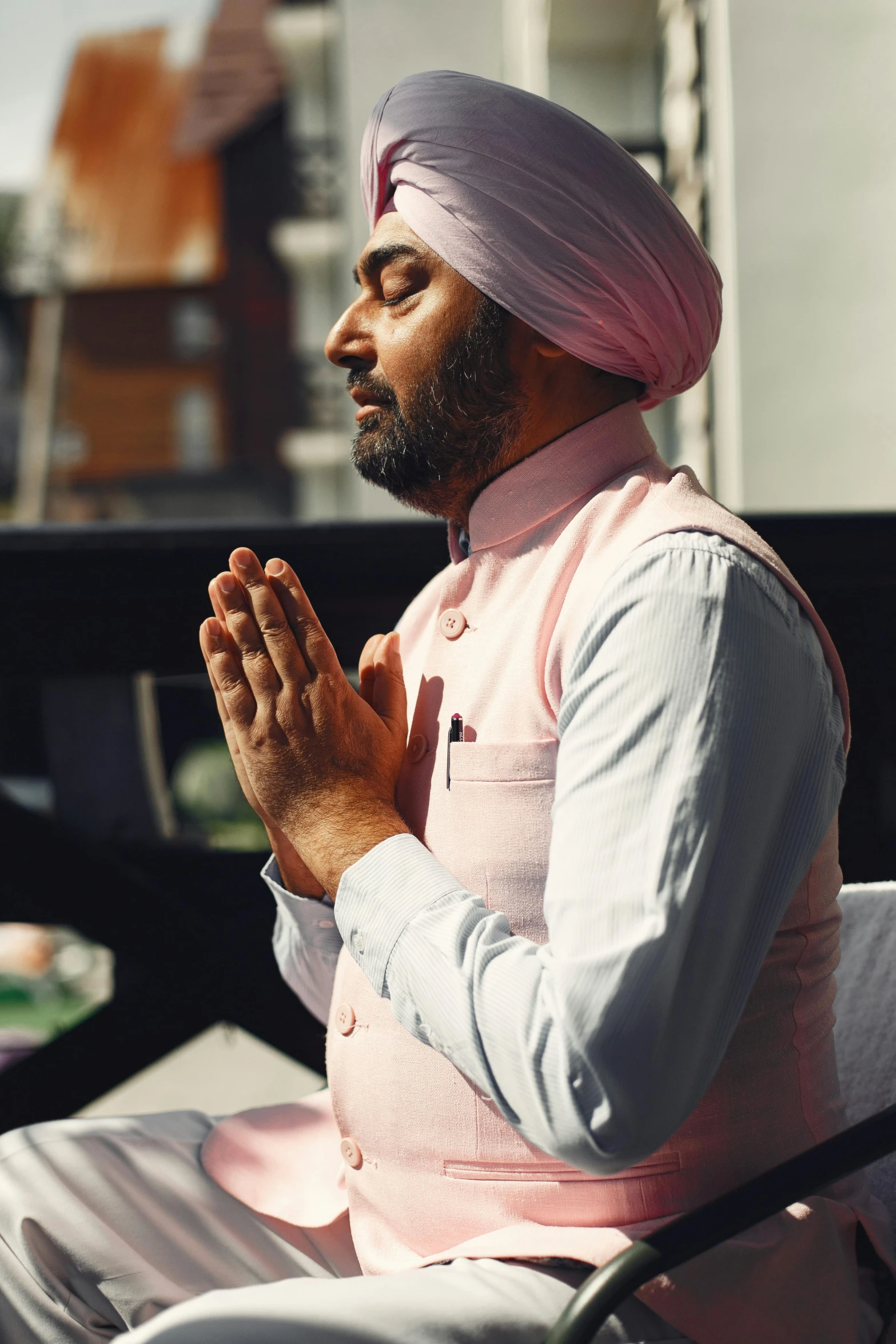 a person in a turban sitting down