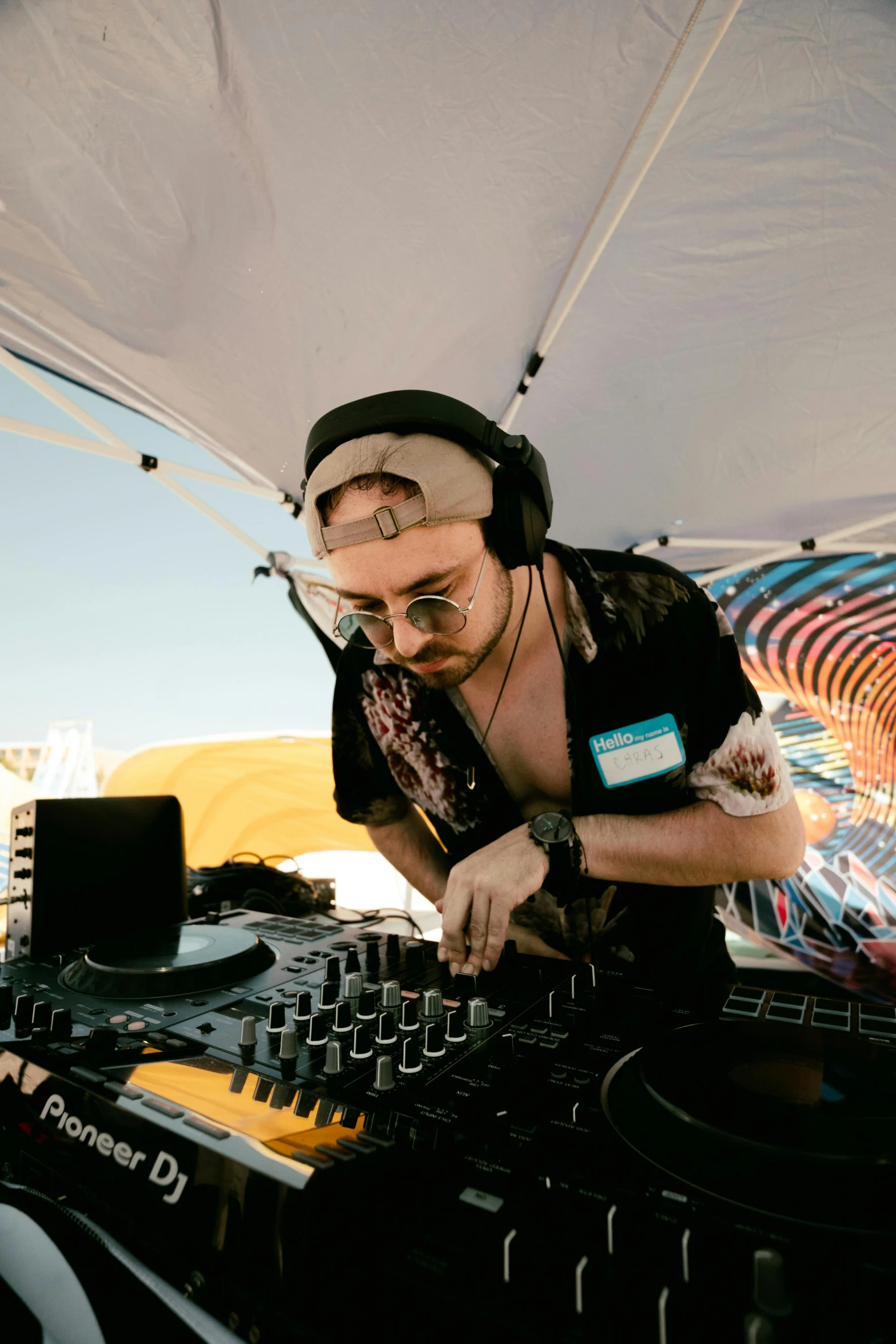 a dj spinning records with headphones on