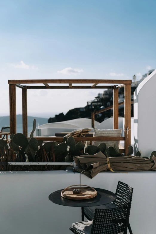 a table on the roof has some kind of desert and a drink