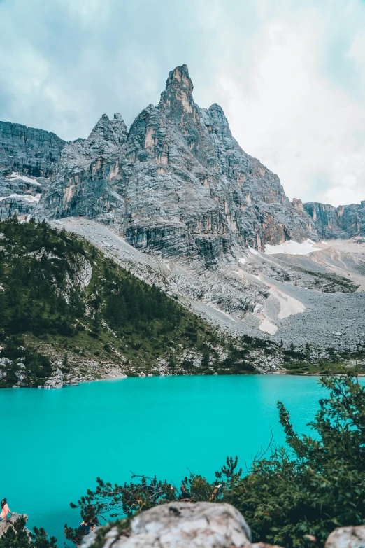 view of a large blue lake surrounded by trees and mountains