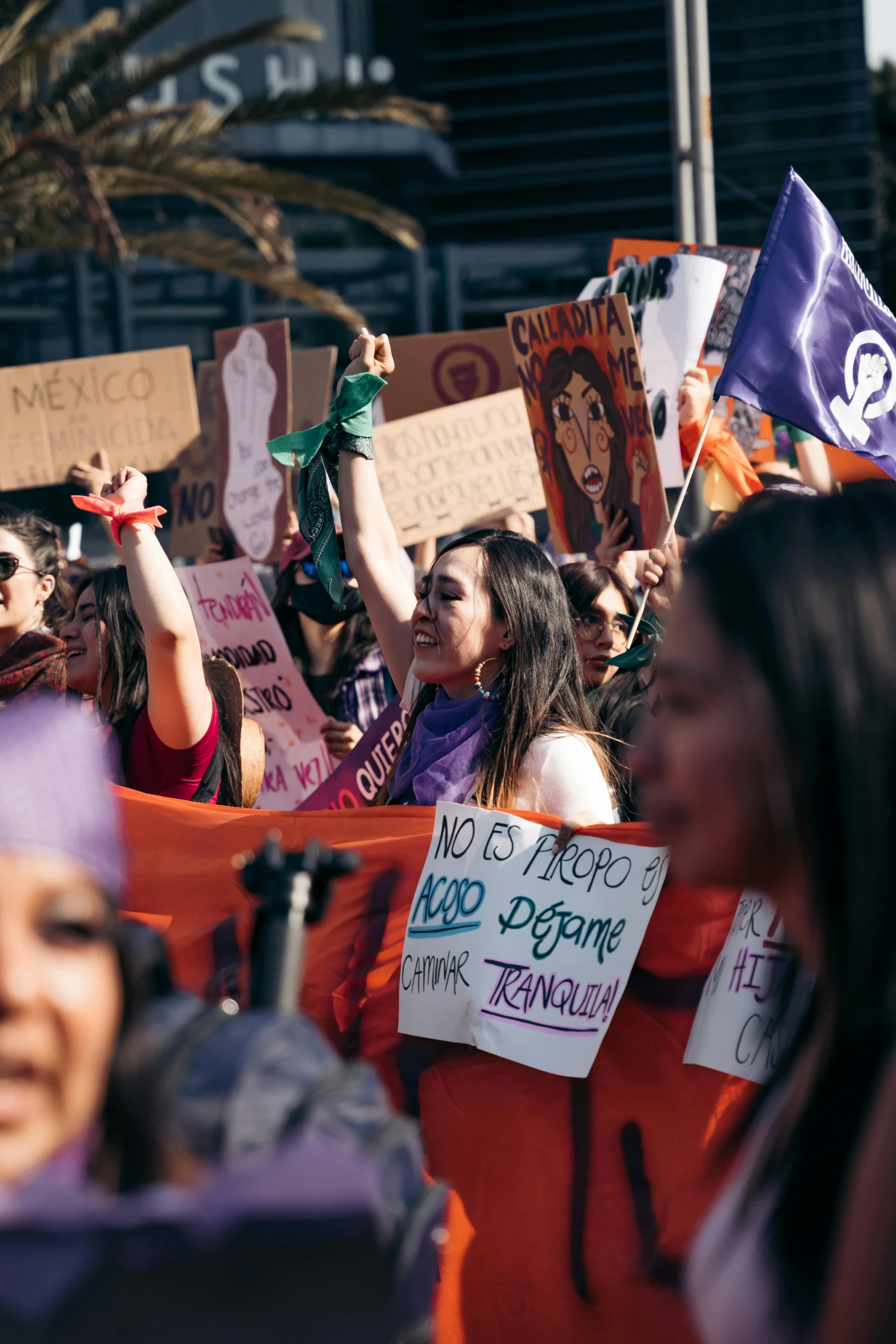 a large group of people holding up signs