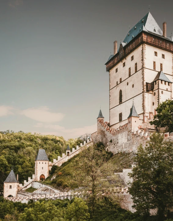 a castle like structure sitting on top of a hill