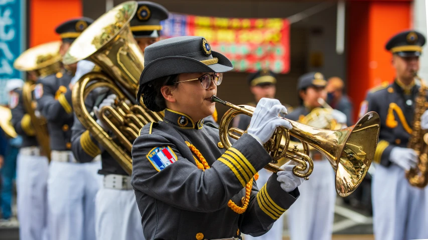 a band member in uniform, with a trumpet