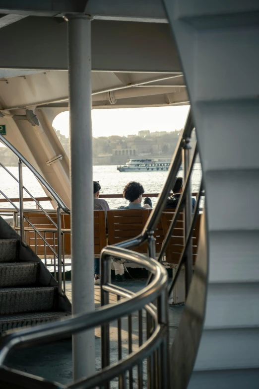 the stairway of a cruise boat is next to the water