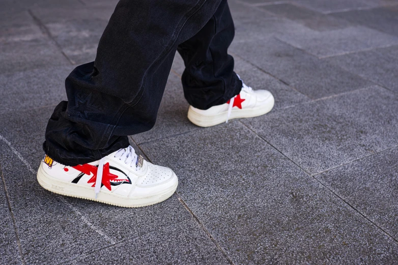 man's shoes decorated with an animal and stars on their toe