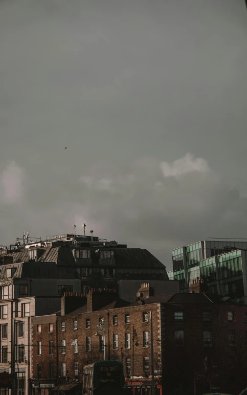 the sky is cloudy over the city skyline