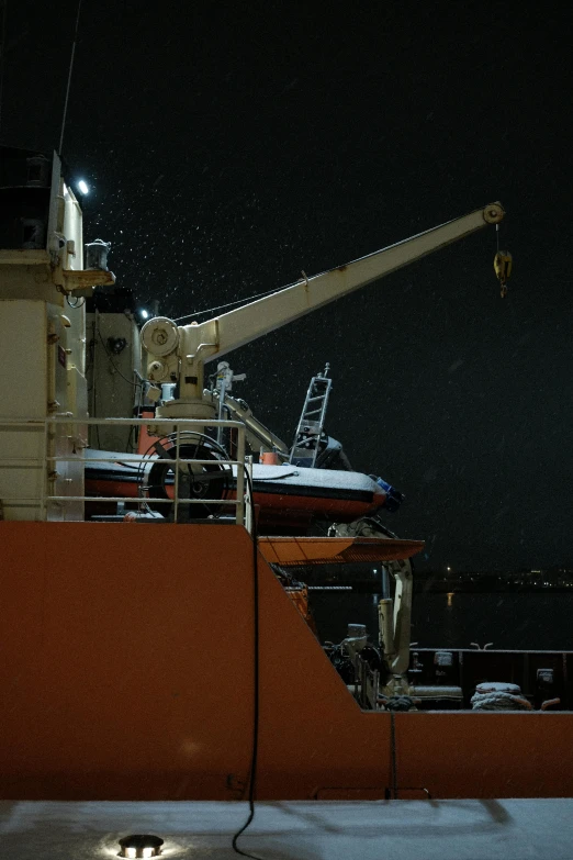 an image of a boat in the ocean at night